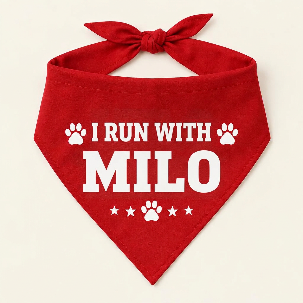 Red dog bandana printed with I RUN WITH MILO and paw prints